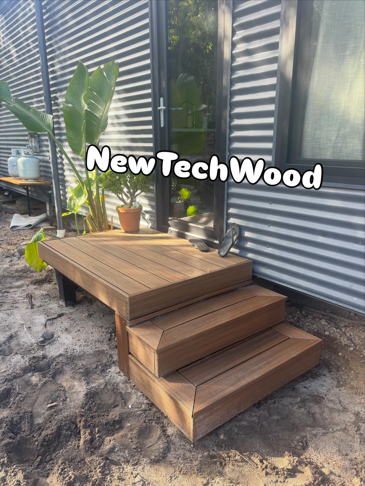 Low-maintenance composite decking and steps, finished for a South West home.